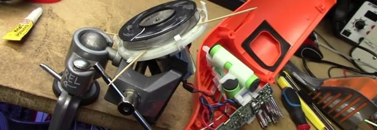Vacuum cleaner repair parts and tools on a workbench in Fort Lauderdale, FL